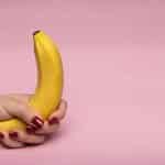 a woman holding a banana