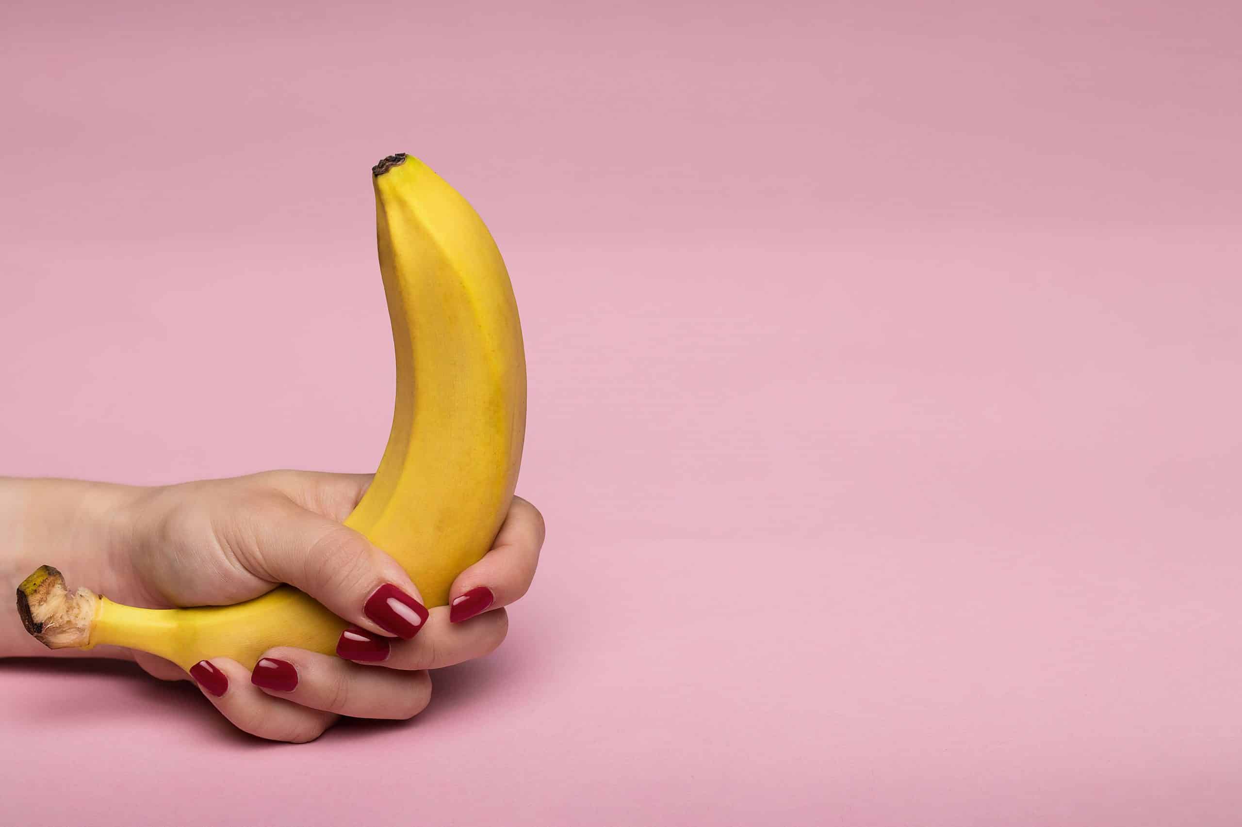 a woman holding a banana