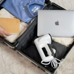 a man packing a suitcase